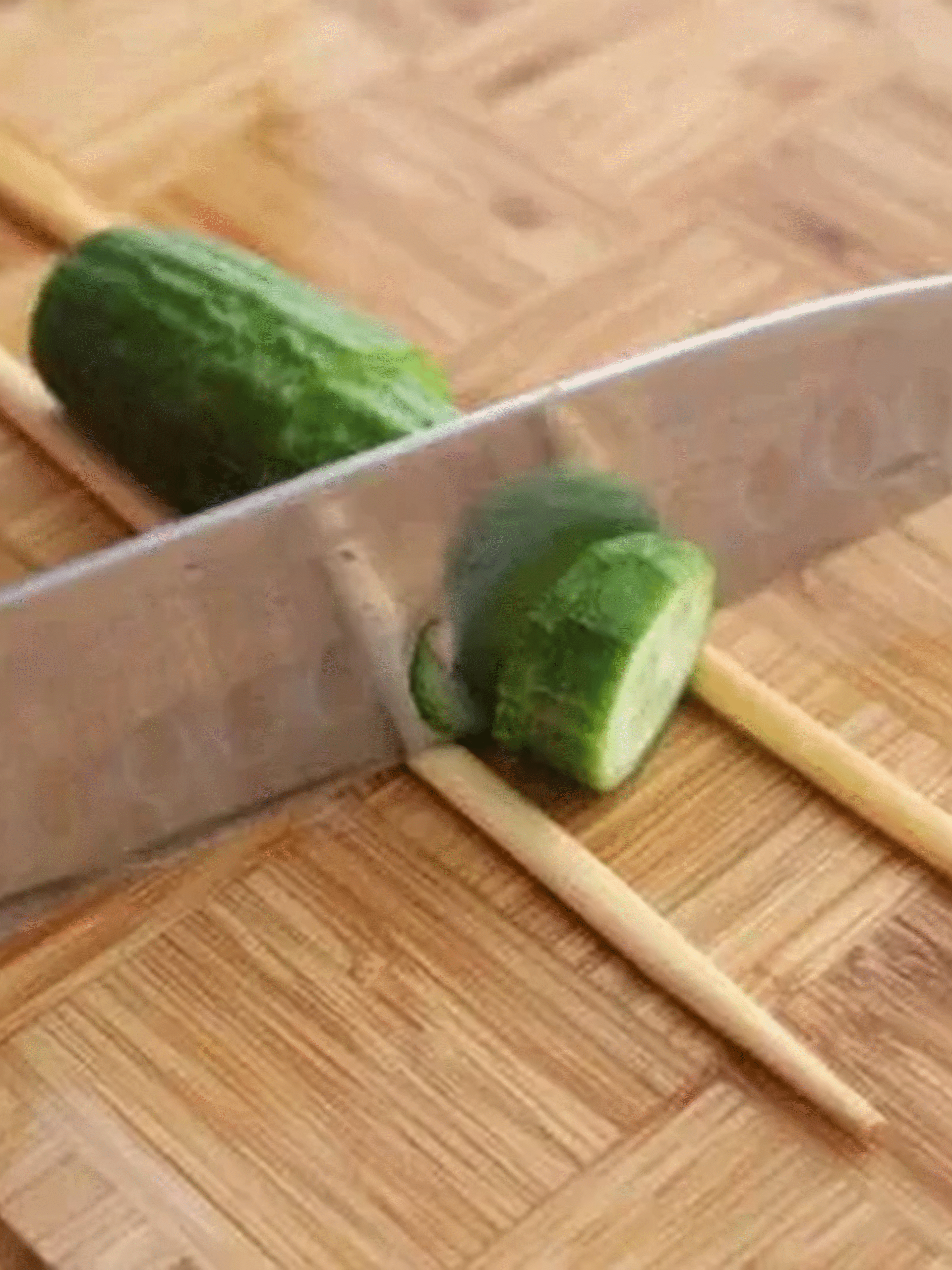 Spiral Cutting Method for Spicy Cucumber Salad Recipe Cutting a cucumber into spirals using chopsticks for spicy cucumber salad recipe