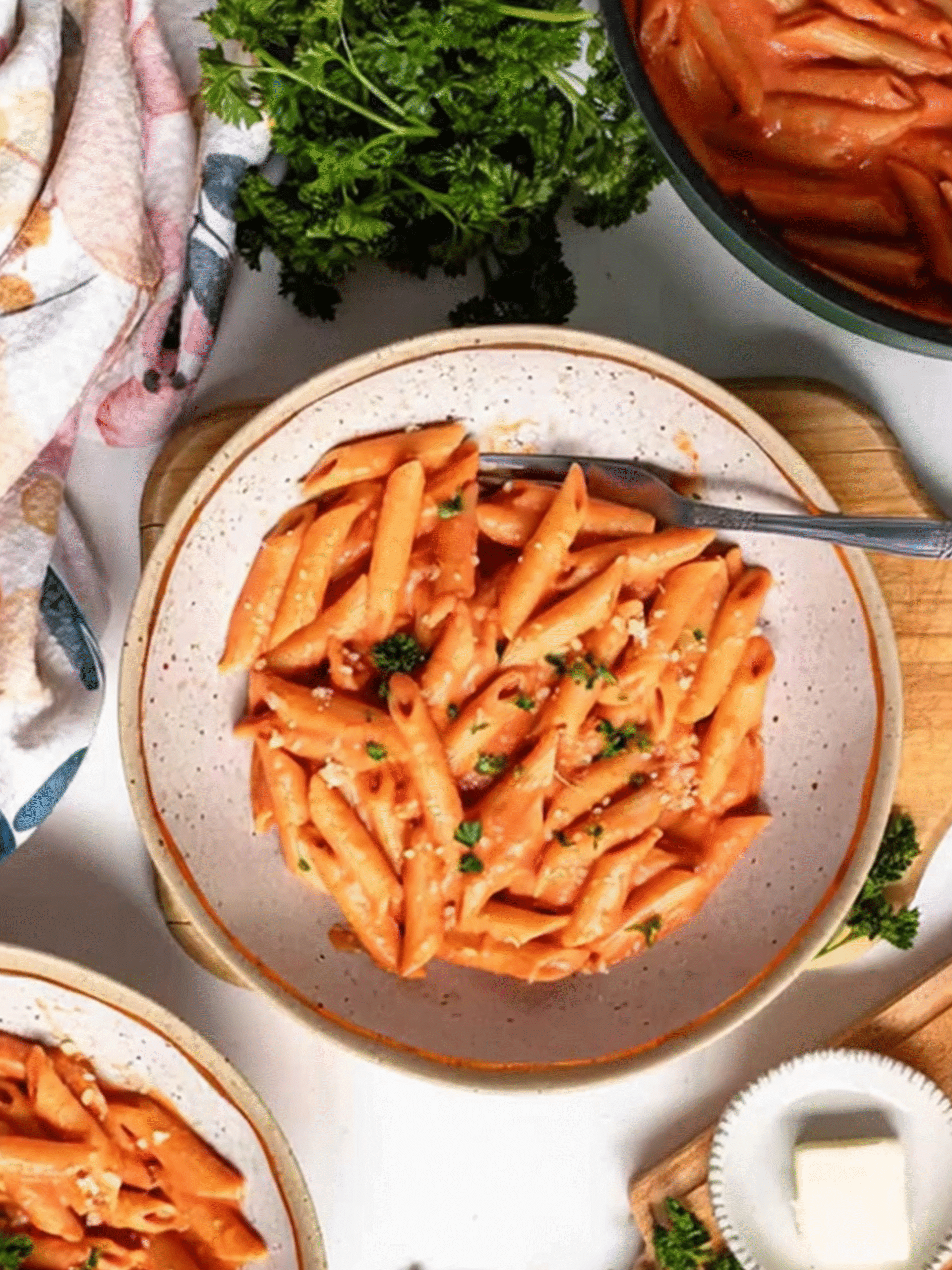 Penne Pasta with Tomato Sauce and Fresh Parsley Creamy penne pasta in tomato sauce topped with fresh parsley and parmesan, served in a rustic bowl