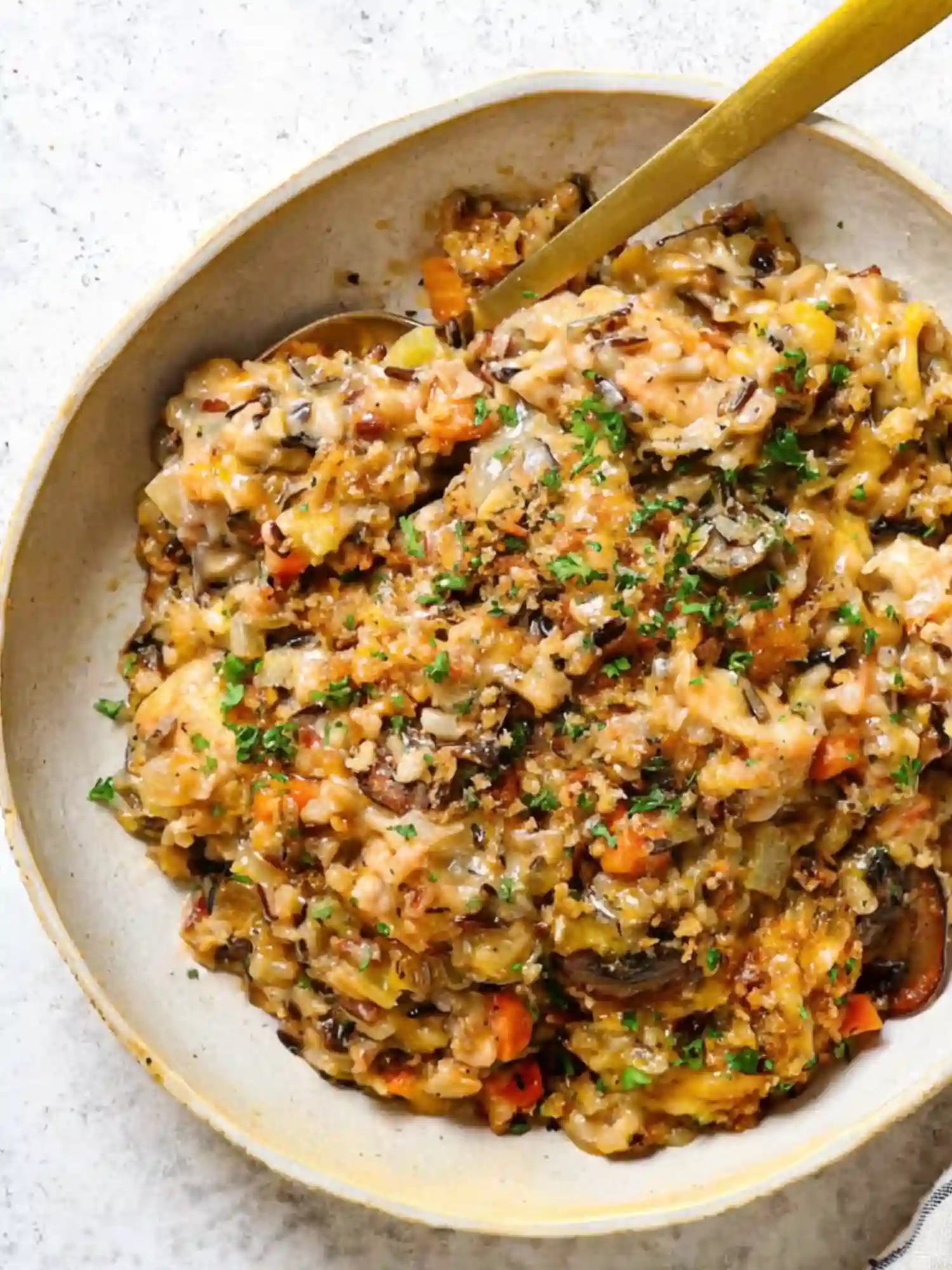 Creamy chicken rice casserole fall serving in a rustic bowl with golden crust and herbs