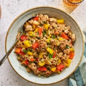 Bowl of cooked ground turkey and peppers recipes with colorful bell peppers and fresh herbs