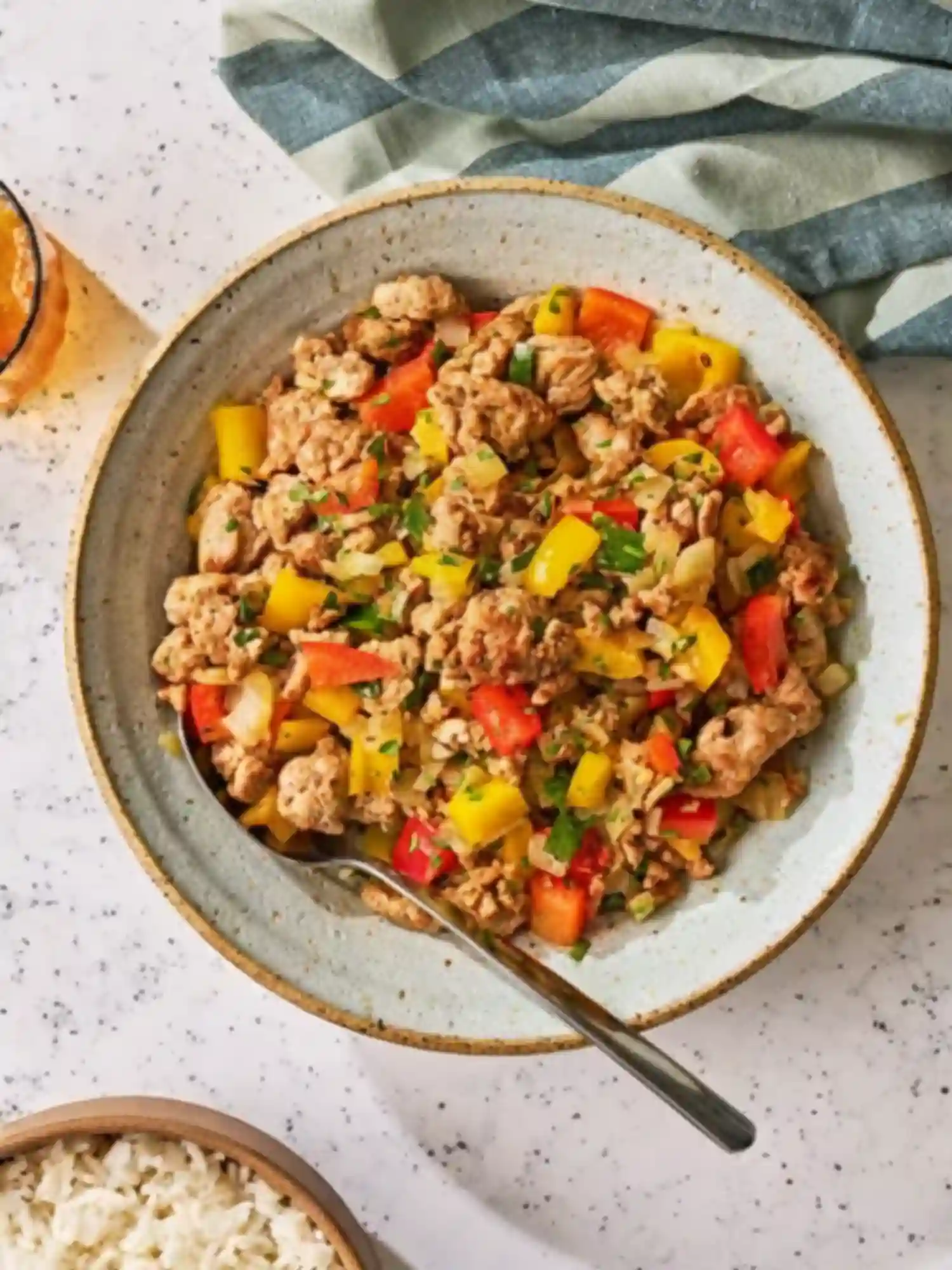 Ground Turkey and Peppers with Rice – Quick Healthy Meal Ground turkey and peppers served in a bowl with a side of white rice