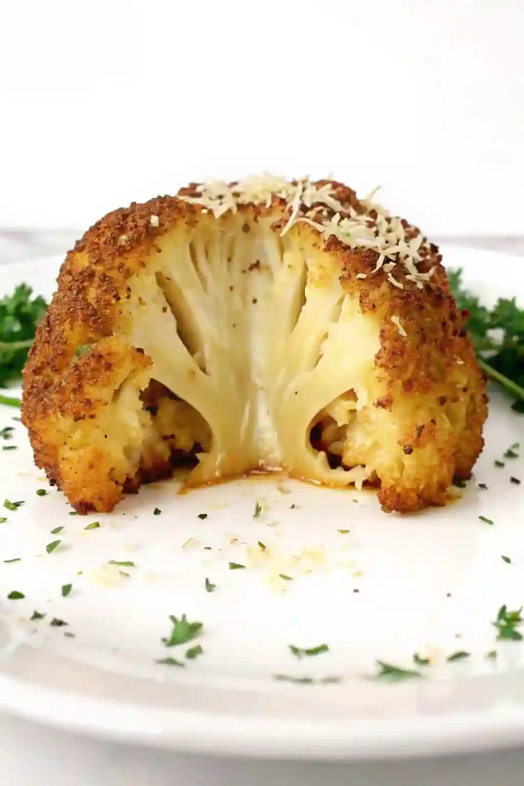 Whole Roasted Cauliflower Parmesan Crispy and Tender whole roasted cauliflower recipe crispy parmesan crust with tender inside cut open