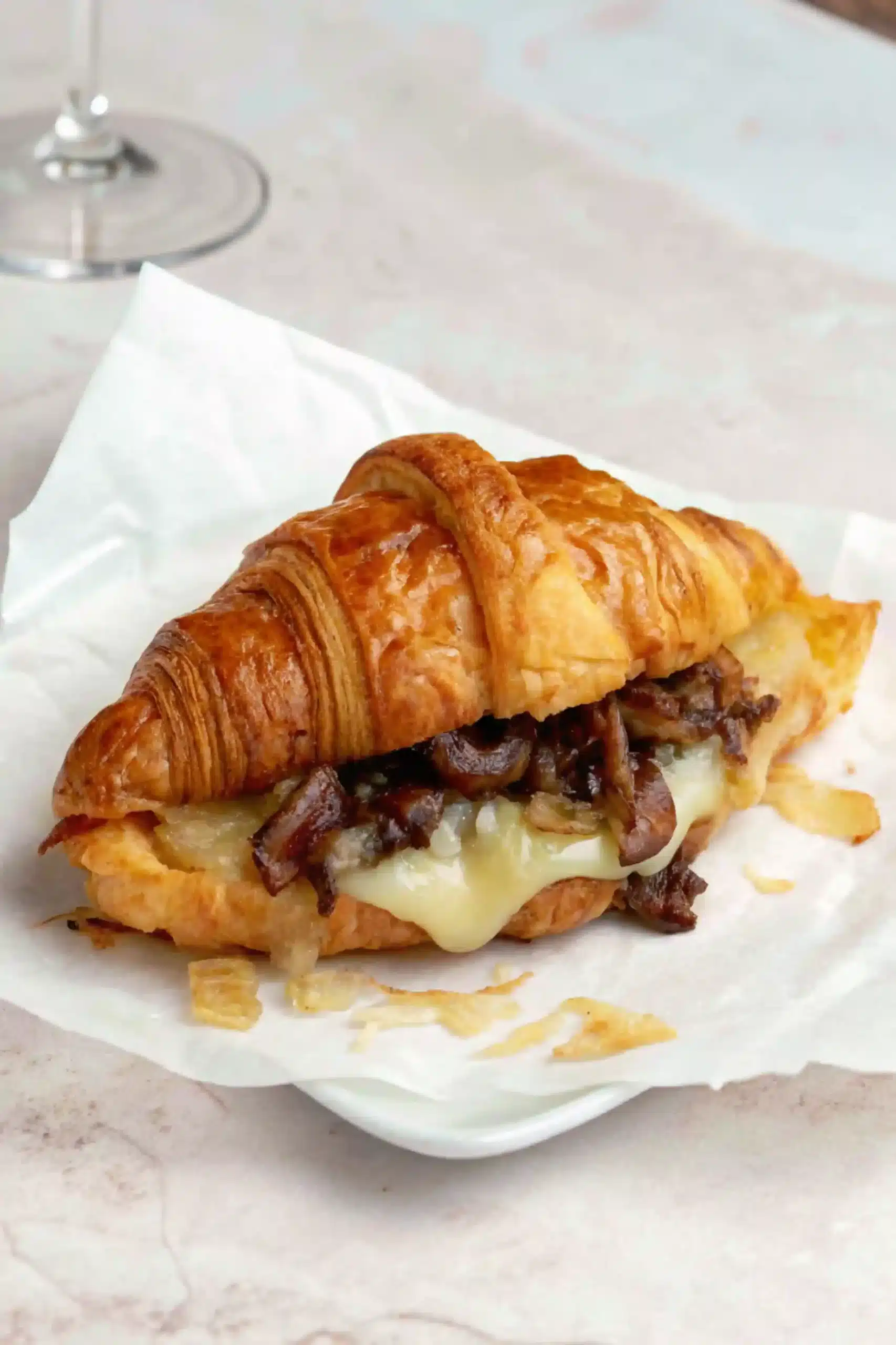 Crispy Croissant Smash Burger Recipe Close Up croissant smash burger recipe crispy burger with melted cheese and caramelized onions
