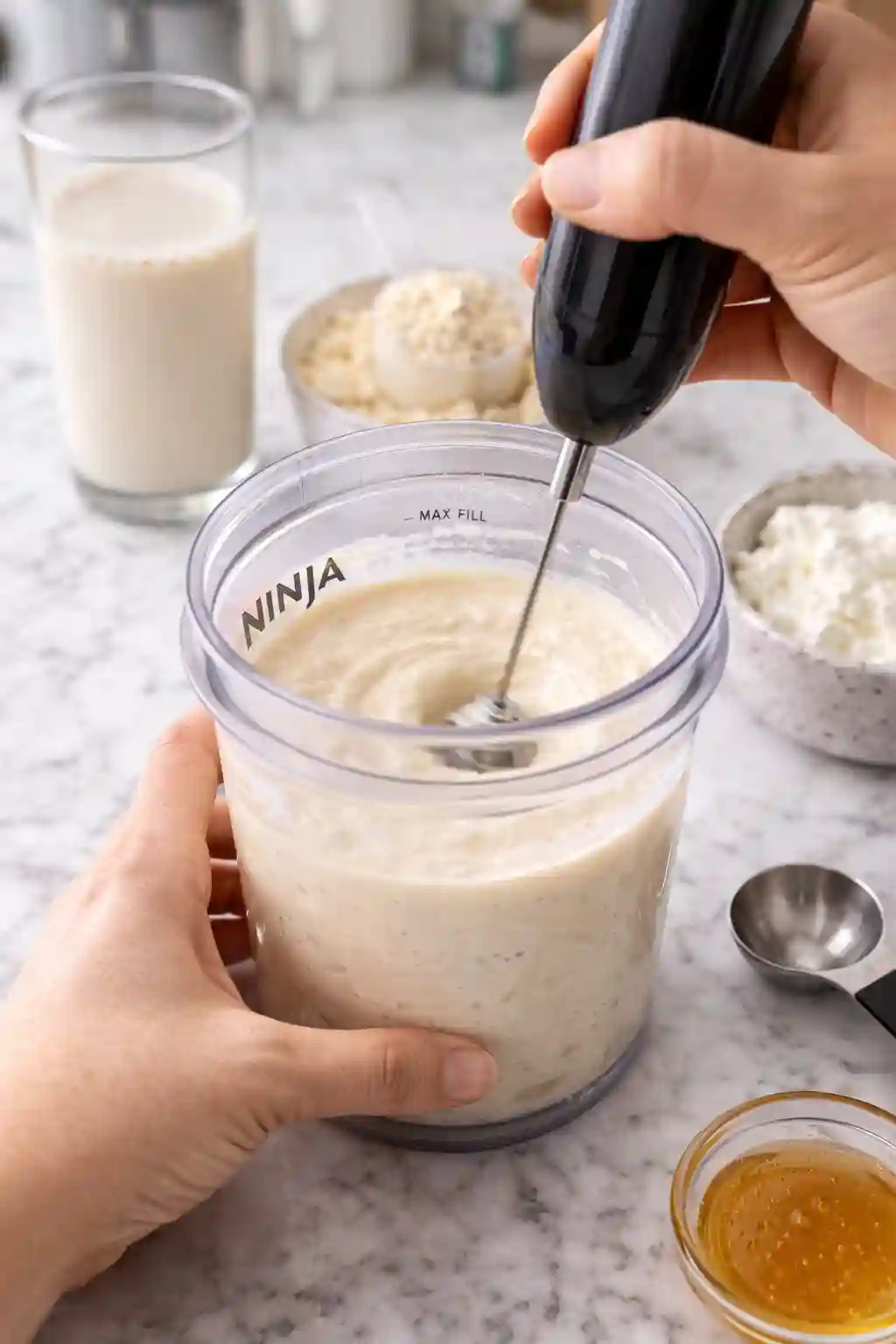 how to make ninja creami protein ice cream mixing ingredients in container with frother creamy texture