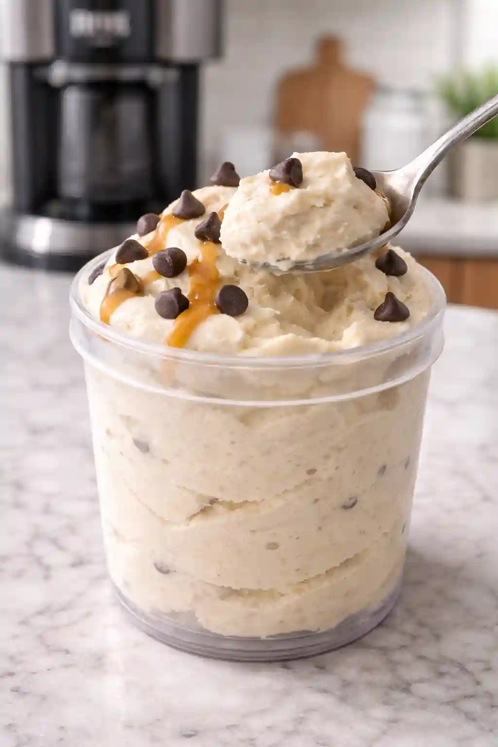 ninja creami protein ice cream recipe creamy scoop with caramel drizzle and chocolate chips close up texture