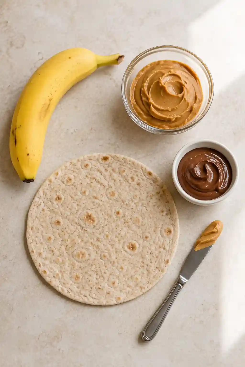 How to Make Banana Sushi in 4 Easy Steps Banana Sushi fun healthy snack kids four-step preparation with peanut butter, banana, tortilla, rolling, slicing, and serving